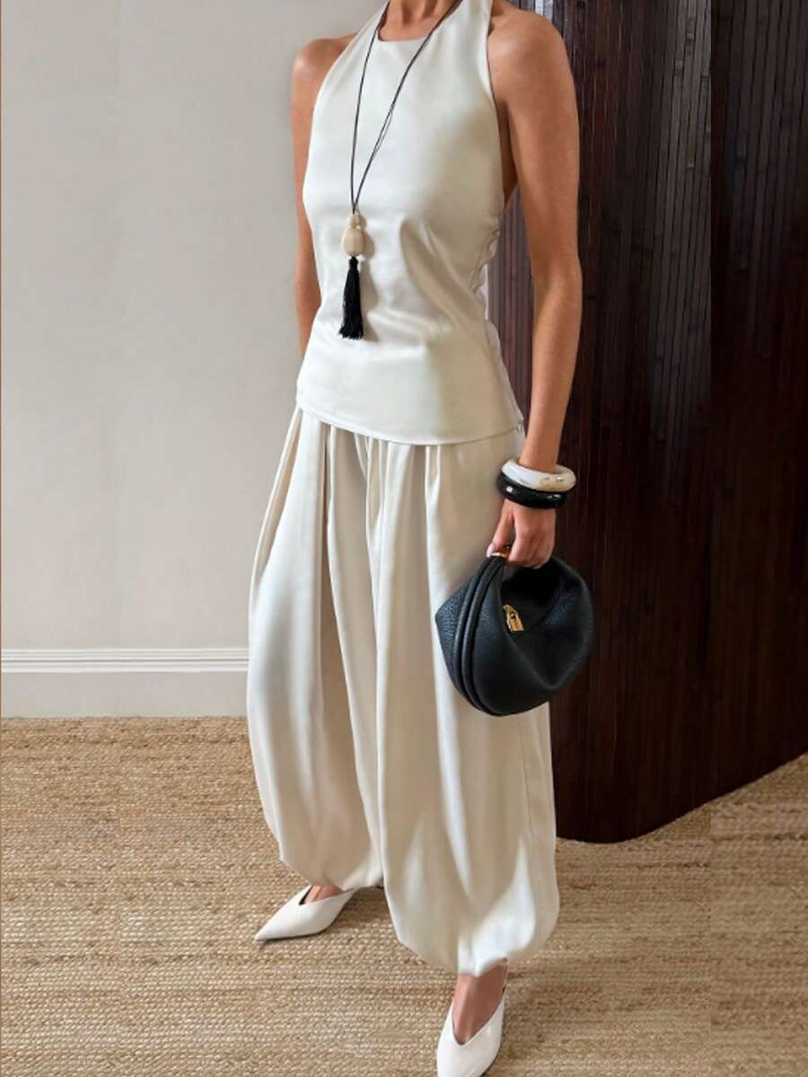 SHEIN BAE Conjunto de 2 piezas para mujer con top de tirantes halter sin espalda y pantalones farol en beige albaricoque, elegante y casual para ir al trabajo, uso diario, salidas casuales, conjunto práctico de satén albaricoque y blanco - Albaricoque - Ver 1