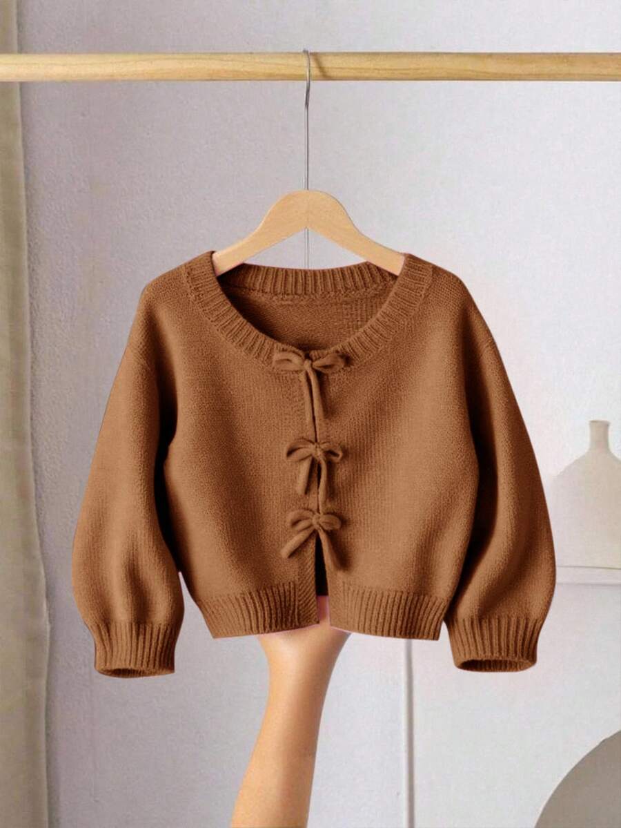 SHEIN LMoss Kids 女童粉色針織秋季毛衣,蝴蝶結裝飾,可愛休閒,柔軟舒適百搭,適合居家、派對、度假場合 - 卡其色 - 查看 1