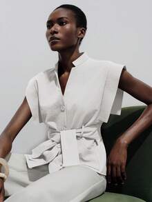 Aveloria Modichic European & American Style Spring/Summer New Fashion Versatile Solid Color Flutter Sleeve V-Neck Tie Waist Sleeveless Blouse - White - View 4