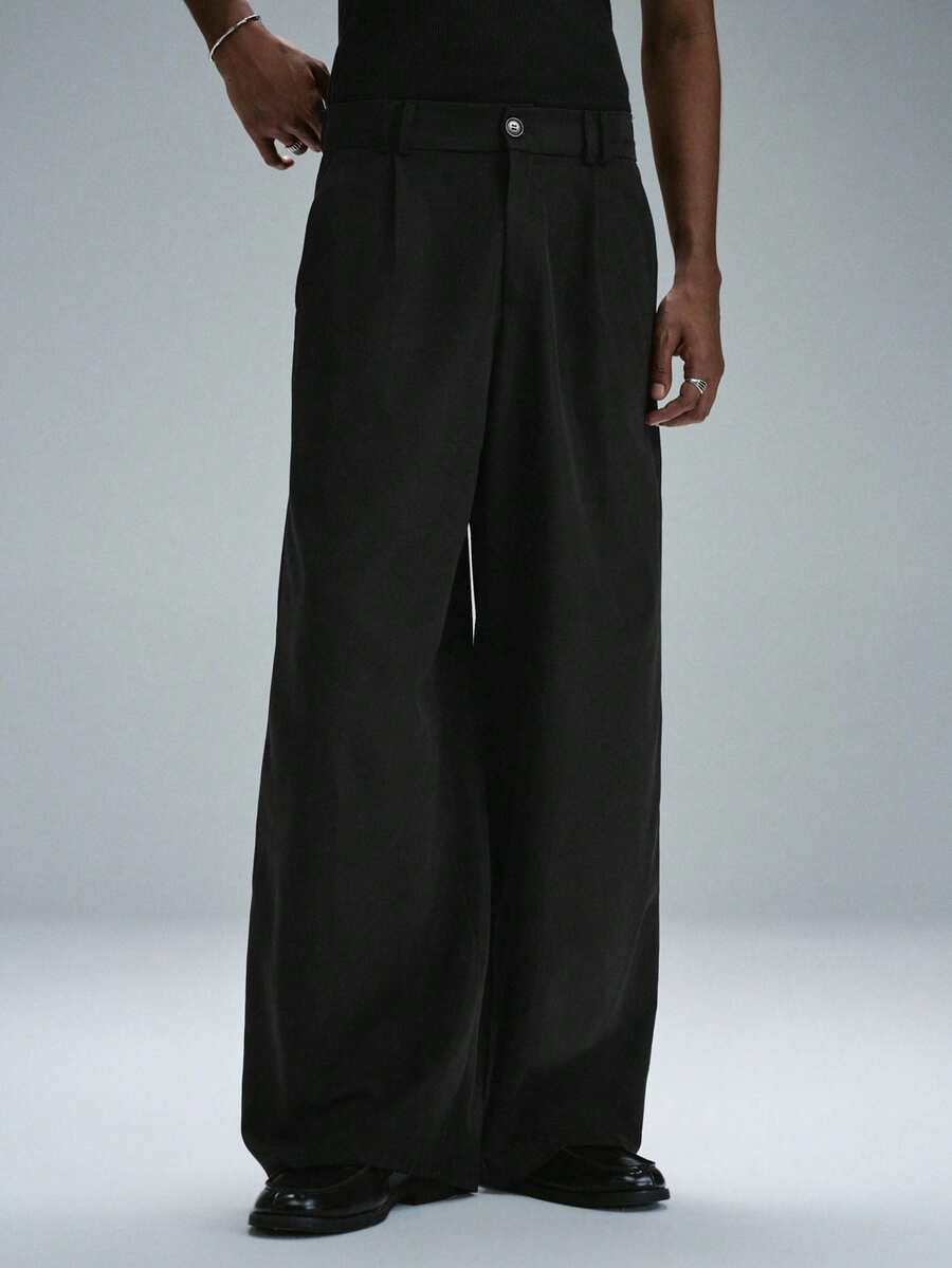STYNVO Pantalones largos de pierna ancha y corte holgado con diseño plisado de unicolor para hombre - Negro - Ver 1