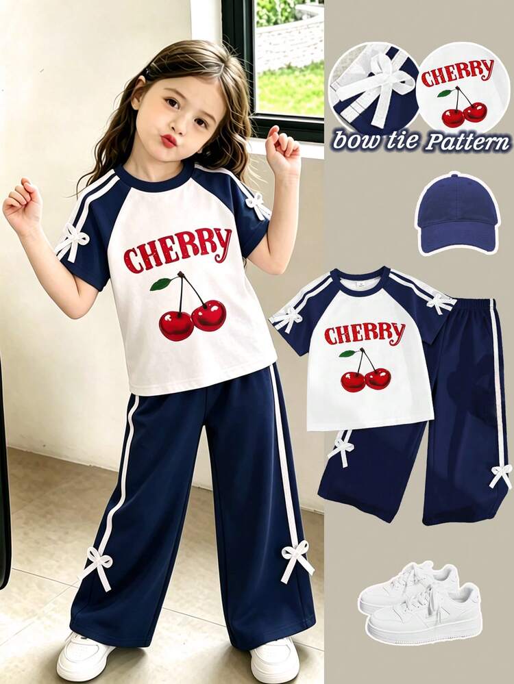 SHEIN Playful Pals 2pcs/Set Girls Red Cherry Pattern T-Shirt And Wide Leg Sweatpants, Knitted Fabric Contrast Raglan Sleeve Design, Cute Cherry Pattern, Sleeves Decorated With Delicate Bows, Vibrant And Sweet. Matching Same Color Wide Leg Sweatpants With One Thick And One Thin White Stripe On The Side, Recreating American Campus Sports Style. Suitable For School, Outings And Vacations - Navy Blue - View 1