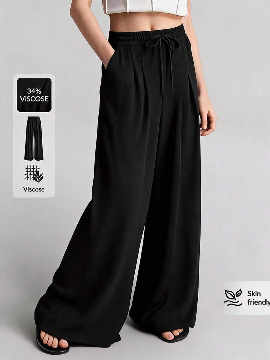 Ontre 2026 春秋款黑色抽繩腰斜口袋摺疊百褶寬腿運動長褲，休閒穿著