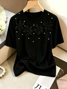 GlowEve CURVE Modisches Damen-T-Shirt in Große Größen mit Rundhalsausschnitt, 3D-Blumen-Perlenverzierung, Kurzarm, elegantes Top für den Arbeitsalltag, Frühling/Sommer - Schwarz - Übersicht 3