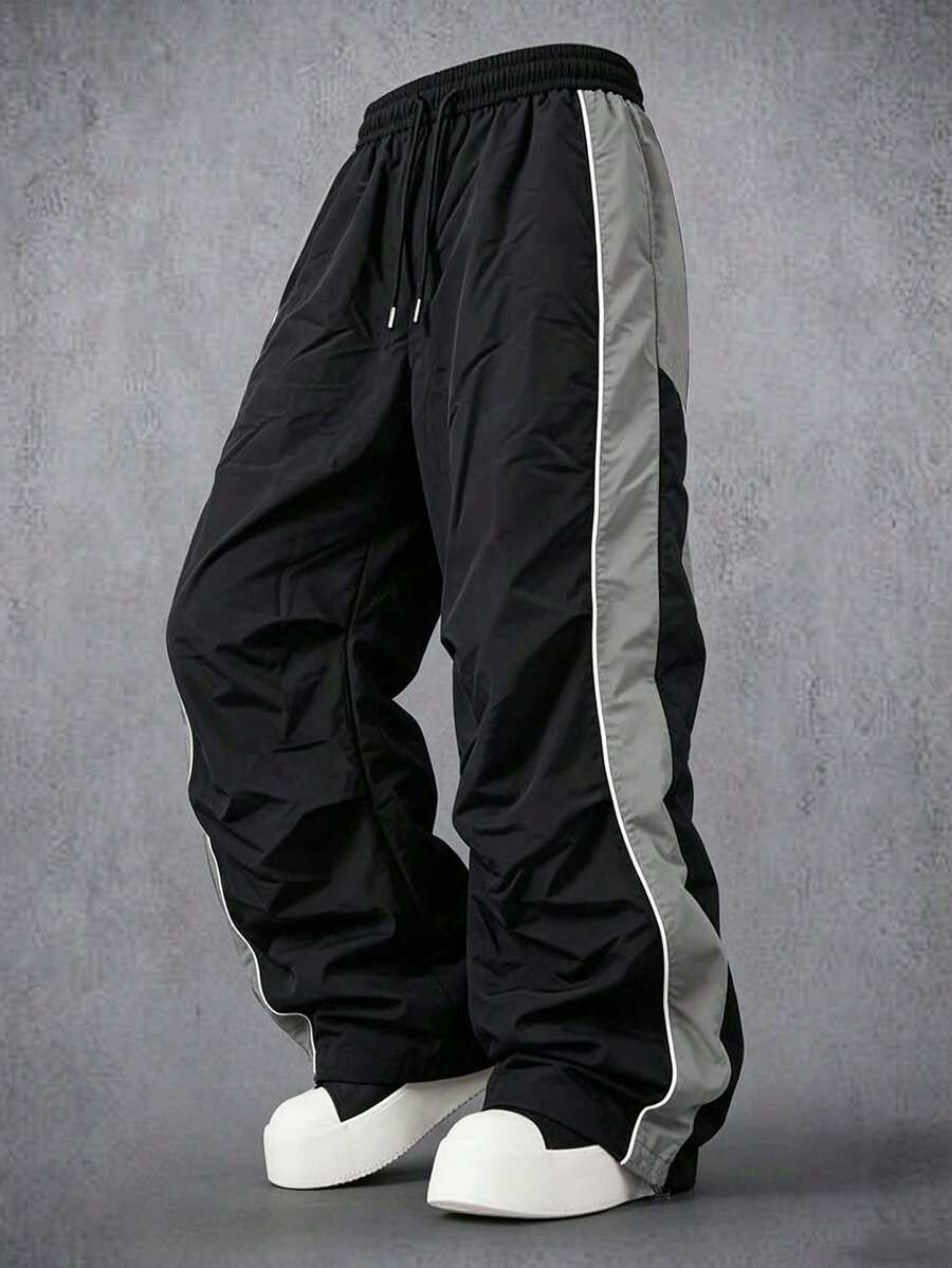Manfinity Denimwave Men Contrast Panel Wide Leg Track Pants, Four Seasons Wear Elastic Waist Drawstring Wind Pants, Loose Baggy Streetwear Trousers With Adjustable Cuffs - Black - View 1