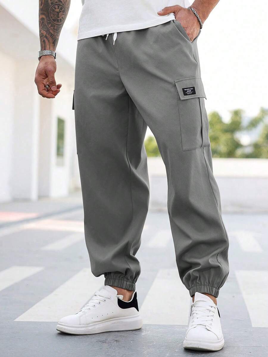 Manfinity Homme Pantalones cargo casuales con cordón en la cintura y gráfico de letras para hombres de talla grande - Gris - Ver 1