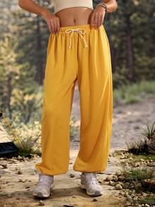 Exploreva Exploreva Women's Solid Color Waist Tie Wide Leg Outdoor Long Pants - Yellow - View 1