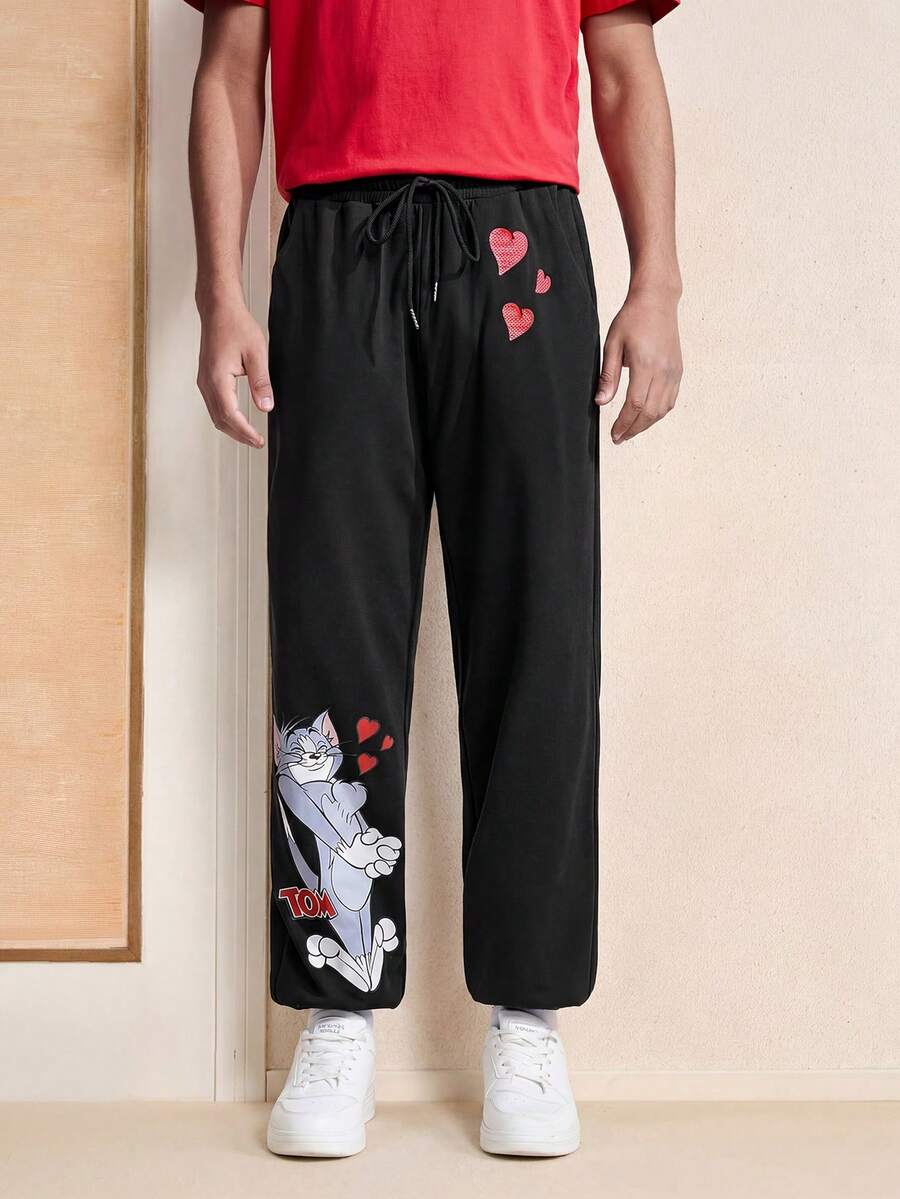 TOM & JERRY X SHEIN Pantalones Con Puños Elásticos Para Hombres Con Patrón De Dibujos Animados - Negro - Ver 1