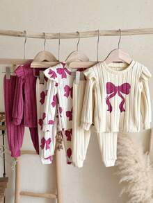 SHEIN Conjunto de 6 piezas para bebé niña con camiseta de cuello redondo, ribete de volantes, estampado de lazo en contraste, punto acanalado cepillado y color liso, y pantalones largos - Multicolor - Ver 6