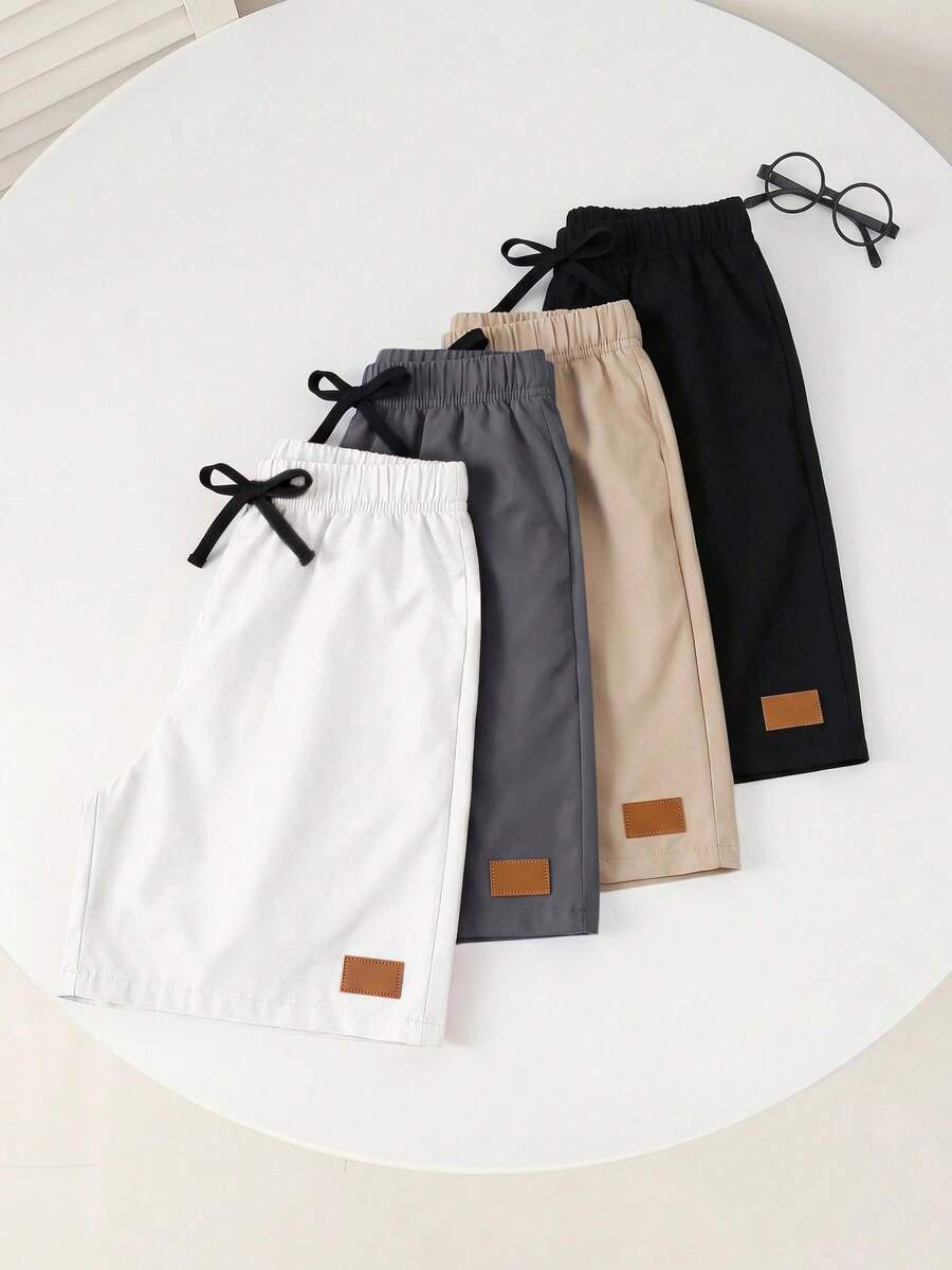 SHEIN 4pcs Kids Young Boy Casual Daily Versatile Comfortable Blue Khaki Black Orange Solid Color Woven Shorts With Patch Label And Drawstring Waist, Multi-Pack, Suitable For Commuting, School, Daily Casual, Vacation, Travel, Sports, Spring, Summer, Fall, Winter - Multicolor - View 1