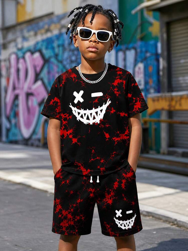 SHEIN Boys T-Shirt Set, Dark Red And Black Splatter Tie-Dye Base Color, Paired With Quirky "Devil Smile" Print, Chest And Shorts Both Printed With Quirky Devil Smile, X-Eyes + Jagged Mouth Design, Soft Knit Round Neck Short Sleeve All-Over Print T-Shirt Pullover Top Paired With Elastic Waistband Pockets Knit Shorts, Boys Clothing, Boys Set - Black - View 3