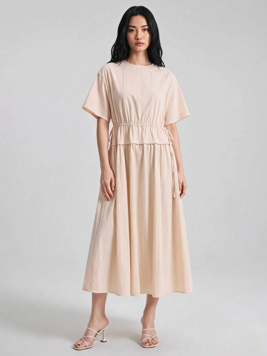 Ontre 女款杏色夏季休閒度假 A 字連身裙，圓領 3/4 袖抽繩收腰，柔軟莫蘭迪色，附口袋與下擺拼接設計