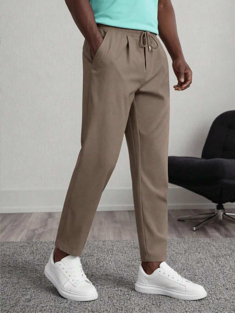 Manfinity VCAY Pantalones casuales de hombre con bolsillos lisos, cintura con cordón, corte cónico, otoño, vacaciones, regalos del Día del Padre, fútbol - Gris - Ver 1