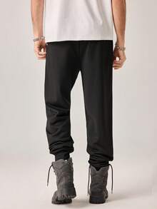 Strevion Men's Casual Commuting & Running Batman Graphic Letter Print Drawstring Waist Pocket Loose Sweatpants - Black - View 2
