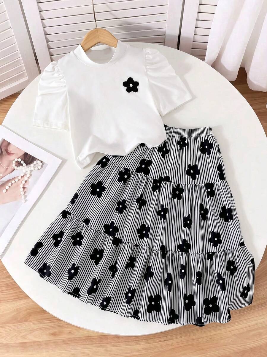 SHEIN Girls' Casual Comfortable Round Neck Puff Short Sleeve Printed Solid Color Top With Mid-Waist Elastic Floral Striped Print Skirt, Spring/Summer Outfit Set - Black - View 1