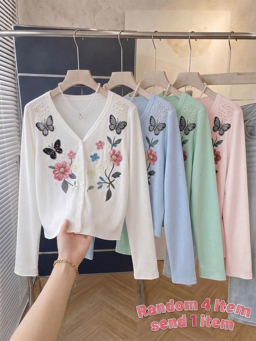 女童純白色V領長袖開襟衫,前襟配圓形白色鈕扣,身著彩色花卉與蝴蝶圖案印花,肩部飾有精緻珠飾,清新印花營造溫柔優雅的柔美甜美氛圍,適合夏季穿著 - 白色 - 查看 1