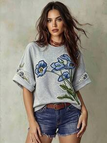 Franclia T-shirt ample et confortable pour femmes, imprimé de fleurs grises, de perles et de diamants, style unique pour les vacances d'été - Gris - Voir 1