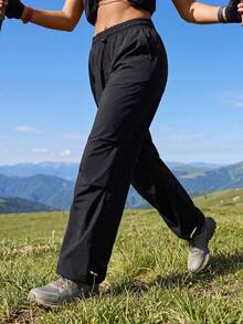 Exploreva Exploreva Women's Minimalist Solid Color Drawstring Waist Pocket Outdoor Long Pants For Sports - Black - View 1