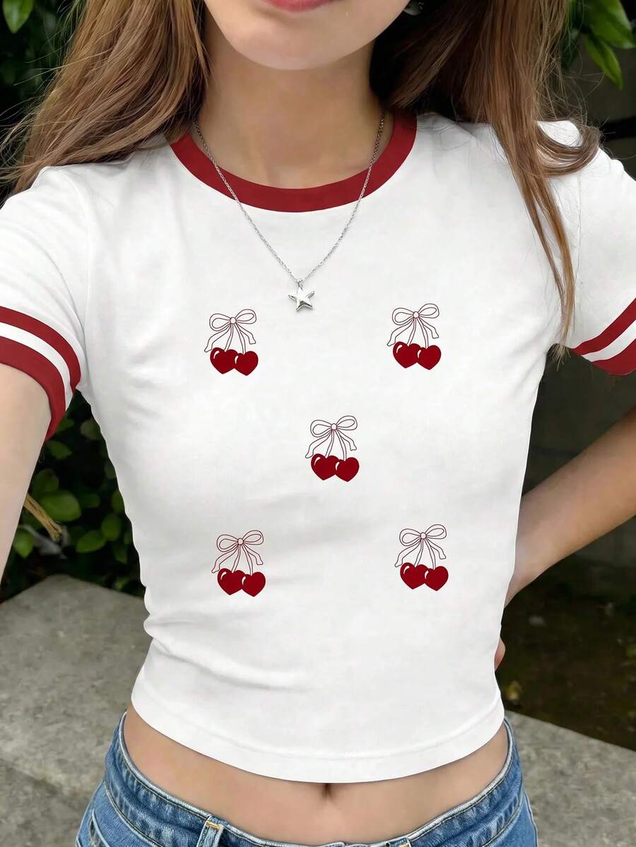 少女休闲简约修身圆领短袖高腰露脐常规T恤,适合夏季穿着。时尚的红白撞色领条纹,搭配靓丽的樱桃图案和可爱的樱桃蝴蝶结。适合春夏日常穿着、度假、居家、旅行、海滩度假、慵懒夏日、休闲度假、轻松舒适、户外活动等场合。 - 彩色 - 查看 1