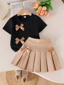SHEIN Genkimix Kids Girls Casual Daily Short Sleeve Bow Decor Black T-Shirt & Khaki Pleated Skirt Academy Style Summer Dress Set - Multicolor - View 1