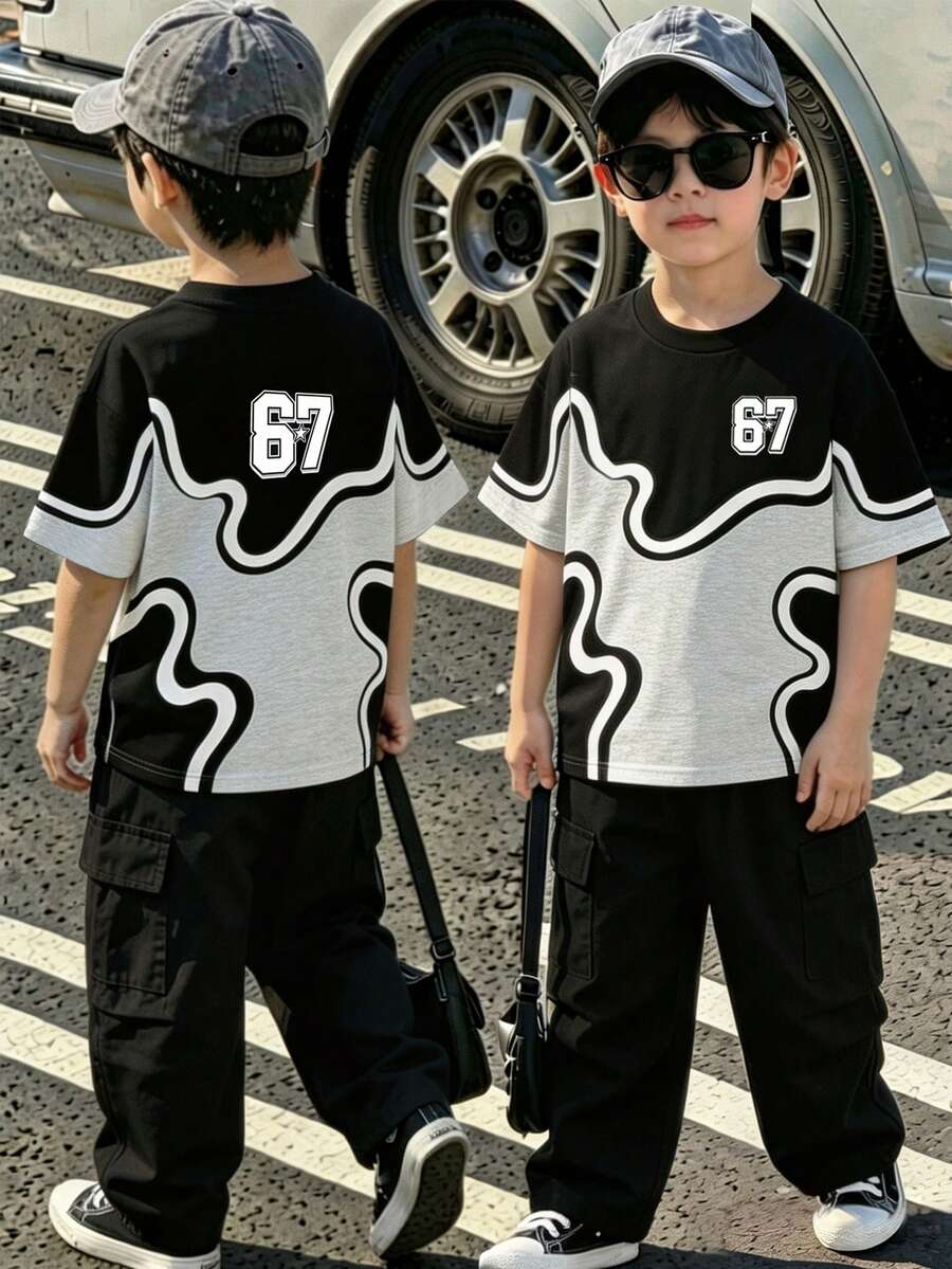 男童時尚運動兩件套,抽象迷彩印花搭配醒目「67」星星標誌設計,包含短袖T恤與配套短褲,柔軟舒適面料,適合夏季日常穿著 - 彩色 - 查看 1