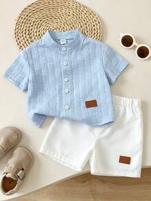 SHEIN 2pcs/Set Young Boy Outfit Set, Textured Woven Stand Collar Button Down Light Blue Shirt & Solid White Elastic Waist Shorts, Preppy Summer Kids Casual - Blue - View 1