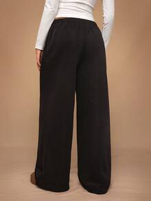 SHEIN Tall CURVE بنطلون رياضي فضفاض كاجوال للنساء بمقاسات كبيرة، لون موحد، خصر برباط سحب، أرجل واسعة - الأسود - مشاهدة 2