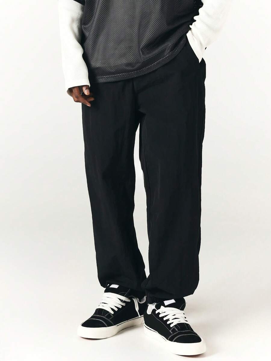 SUMWON Mens Loose Fit Nylon Track Pants With Elastic Ankles And Side Pockets Casual Streetwear Trousers For Spring Summer - Black - View 1