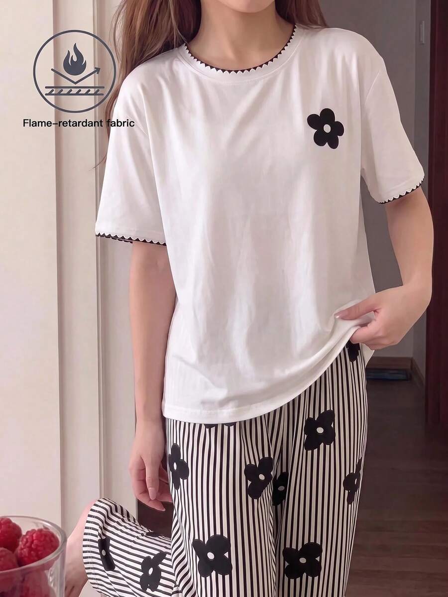 SHEIN Tween女孩睡衣套裝 優雅休閒極簡通勤風 圓領短袖T恤+寬鬆長褲家居服 適合四季穿著 - 黑與白 - 查看 1