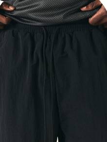 SUMWON Mens Loose Fit Nylon Track Pants With Elastic Ankles And Side Pockets Casual Streetwear Trousers For Spring Summer - Black - View 7