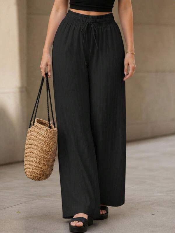 Pantalón de pierna ancha para mujer. Tela muy suave y cómoda. Ajuste de cintura natural con cordón ajustable. Colores lisos sin estampados. Sin bolsillos.