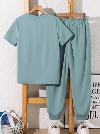 SHEIN Kids Tween Boy Green Spring Summer Soft Comfortable High Elasticity Fabric Patchwork Knit Round Neck Short Sleeve Pullover Top And Elastic Waist Long Pants 2 Pieces Set Suitable For Outings, Vacations, School