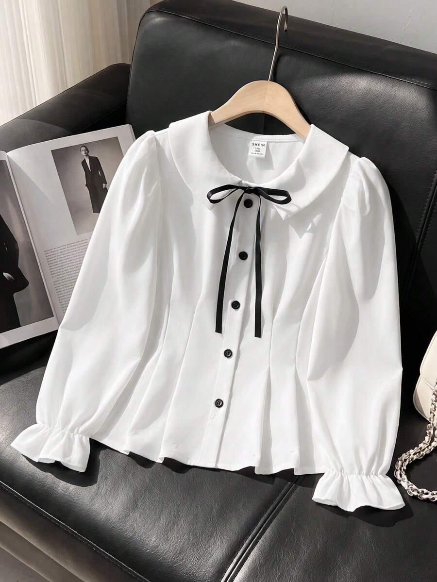 SHEIN 少女裝黑色裝飾蝴蝶結對比鈕扣收腰 A 字版型泡泡長袖白色襯衫,優雅時尚校園風秋冬穿搭 - 白色 - 查看 1