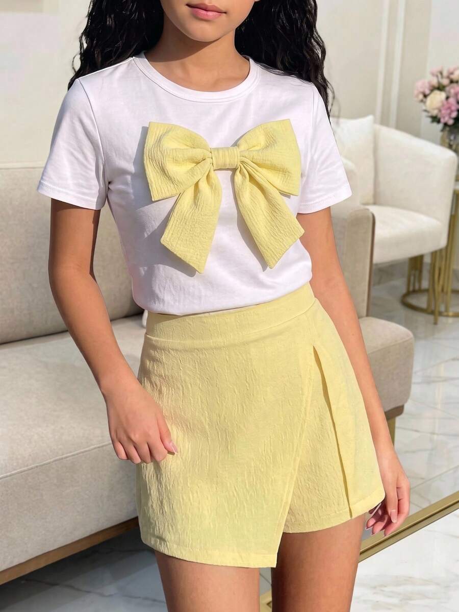 SHEIN 青少年女孩短袖T恤 + 不對稱裙褲,清新甜美風格,正面飾有大3D蝴蝶結,不對稱裹身裙褲,適合日常上學、戶外玩耍、生日派對、好友聚會、夏季海灘、海灘派對等多種場合 - 黃色 - 查看 1