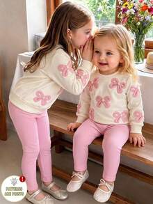 SHEIN Playful Pals 2件組女嬰春秋米色與粉色甜美溫柔風 3D針織蝴蝶結滿版印花圓領長袖上衣與直條紋修身長褲套裝，寬鬆舒適，適合日常穿著、戶外玩耍、家庭聚會、1歲生日派對、拍照 - 粉色 - 查看 3