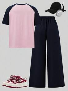 SHEIN Sparklyn 這套 T-Shirt 套裝採用粉色與綠色拼接設計，落肩短袖搭配蝴蝶結裝飾圖案 + 直筒寬腿褲，寬鬆休閒版型，甜酷混搭風格，適合日常出遊，搭配飾品更顯活力 - 藍色 - 查看 5