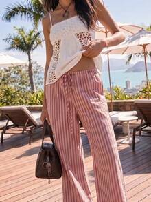 Nöista Pantalones anchos a rayas en color rosa, con una silueta recta y relajada, son elegantes y casuales. El color suave y elegante, así como el material ligero, los hacen adecuados para diversas ocasiones de primavera y verano, desde el trayecto diario hasta las cafeterías y los viajes de fin de semana. Se pueden combinar con tops de punto cortos, camisas y camisetas para crear diferentes estilos. - Rosa - Ver 4