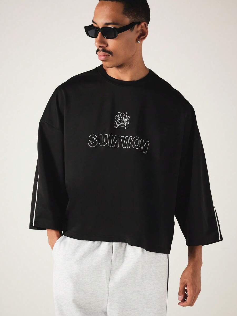 SUMWON Boxy Crop Crew Neck Tee With Contrast Piping Detail And Embroidered Logo Print For Casual Street Style - Black - View 1
