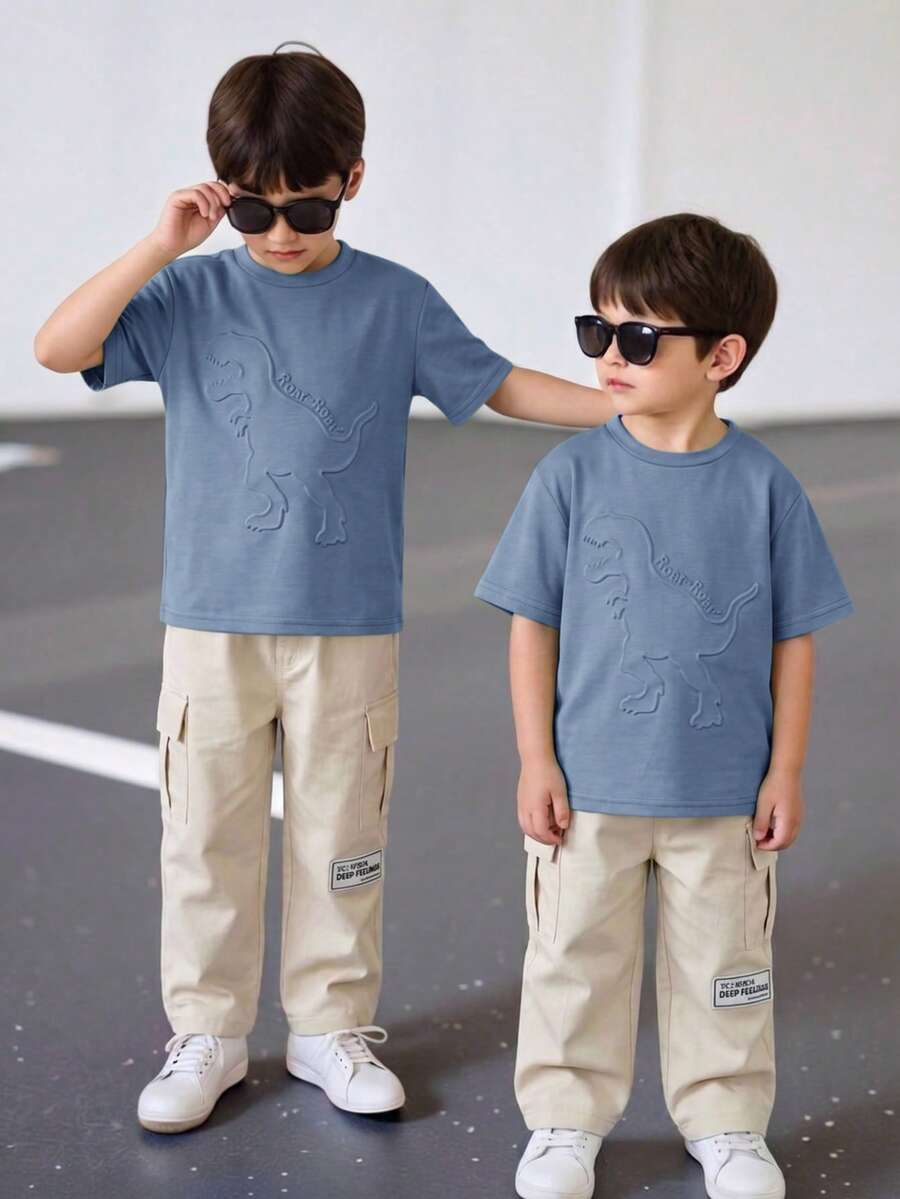 SHEIN Young Boys 3D Dinosaur & Letter Embossed Pattern Crew Neck Short Sleeve T-Shirt With Cargo Pocket And Contrast Stitching, Grey Long Pants 2-Piece Set, Suitable For Spring, Summer, Autumn, Casual, Sports, Outings, Vacation, School, Party Occasions, Fashionable And Versatile - Blue - View 1