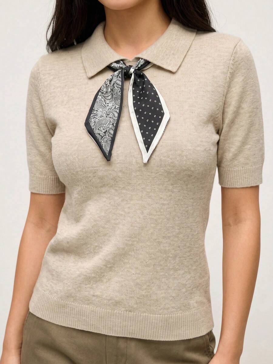 SHEIN Orluneo 新款春夏休闲简约圆领无袖上衣,采用佩斯利印花和波点拼接,展现法式优雅风格,短款设计,比例优化,可搭配连衣裙或裤装,宽松版型,袖口和领口采用罗纹饰边,撞色蝴蝶结设计。 - 杏色 - 查看 1