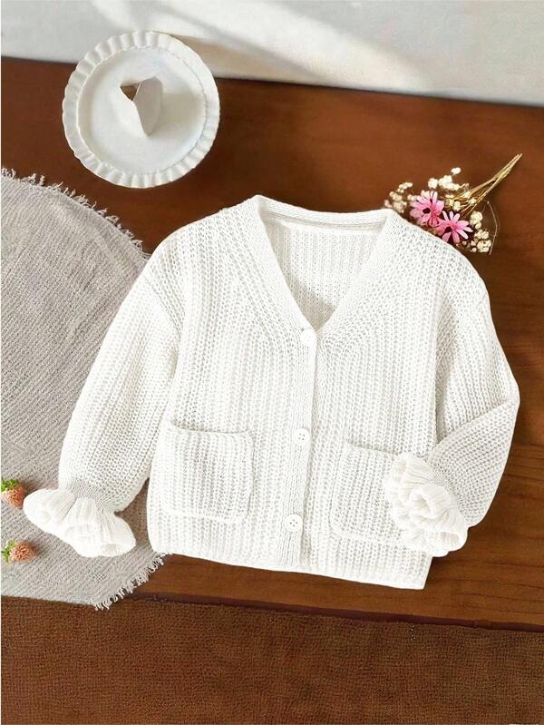 SHEIN Vintaside Kids قطعة واحدة من كارديجان الفتيات، بأسلوب بسيط، لون موحد، ياقة على شكل حرف V، صدر واحد، جيوب مزدوجة متماثلة، أكمام مكشكشة فريدة، كارديجان محبوك أبيض مجوف، ملابس علوية متعددة الاستخدامات، مناسب للمنزل والخروجات، الربيع والخريف