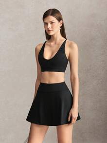 Activina Damen Sommer- und Frühjahrs-Activewear Zweiteiler Set mit schwarzem Sport-BH mit Kreuzrücken, Mini-Skater-Rock und praktischer Tasche, ideal für Sport - Schwarz - Übersicht 6