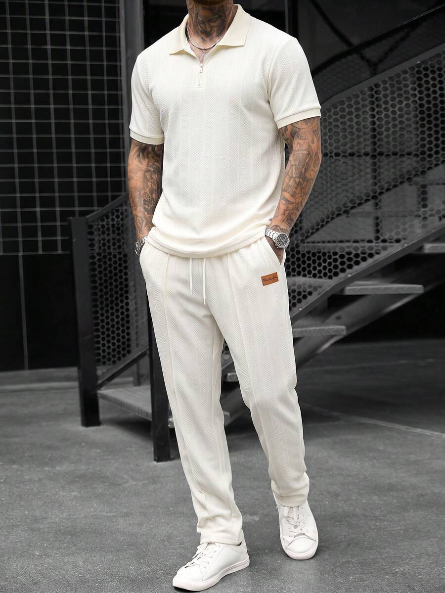 Manfinity CasualCool 男士春夏高品質 Polo 套裝,熱銷舒適斜紋素色提花布料,經典短袖拉鍊 Polo 衫 + 抽繩鬆緊腰長褲,休閒度假、極簡辦公、朋友約會、派對聚會、宴會,適合正式或非正式場合,極簡熱銷百搭風格,適合自穿或送給朋友 - 米色 - 查看 1