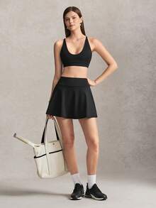 Activina Damen Sommer- und Frühjahrs-Activewear Zweiteiler Set mit schwarzem Sport-BH mit Kreuzrücken, Mini-Skater-Rock und praktischer Tasche, ideal für Sport - Schwarz - Übersicht 4