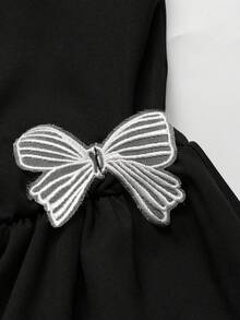 GlowEve Women's Asymmetric Neckline Short Dress With Bow Decor - Black - View 4