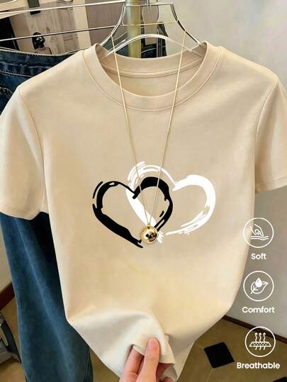 Camiseta de mujer de verano holgada informal con cuello redondo y manga corta, estampado de corazones. Modelo casual versátil básico, excelente prenda de regalo para amigos.