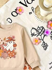 SHEIN 2026 女童幼兒萬聖節新款奶油白圓領長袖運動衫，印有卡通幽靈、南瓜與花朵組合圖案，幽靈戴著女巫帽，暖橘粉色調，低飽和可愛風格 - 彩色 - 查看 6