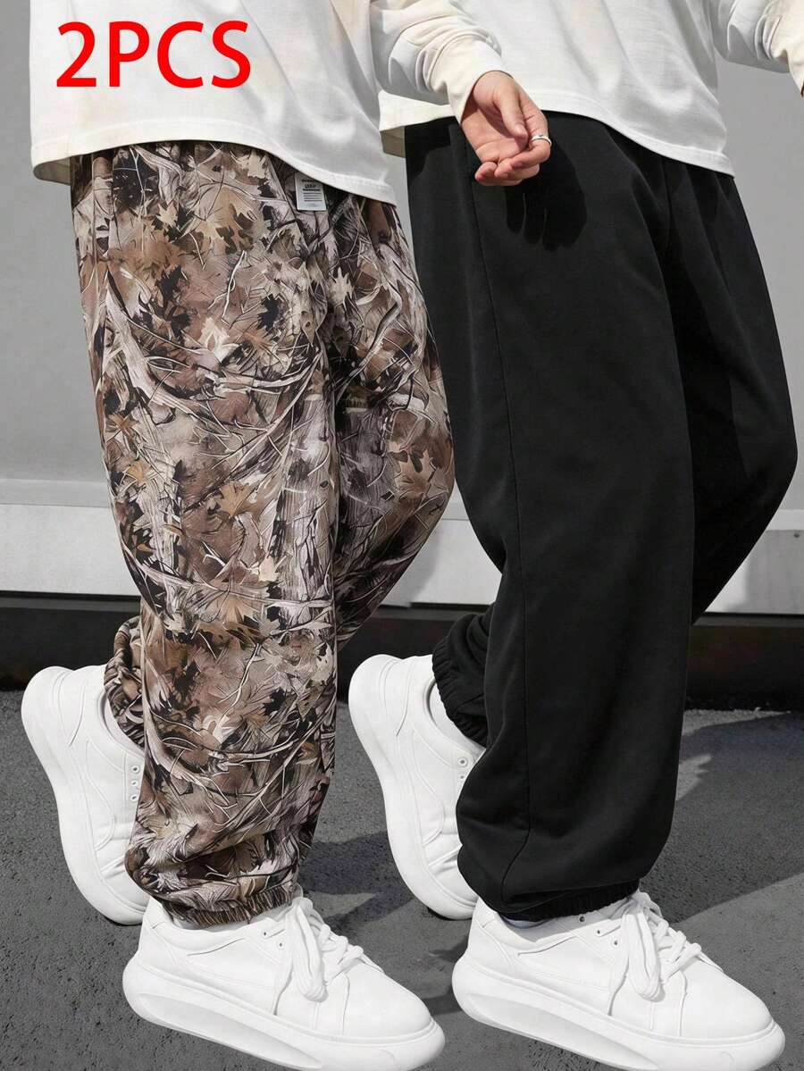 SHEIN Explorewe 2件組青少年男孩休閒慢跑褲套裝,迷彩葉子印花與純黑色收口運動長褲,青少年寬鬆街頭風運動長褲,秋季 - 彩色 - 查看 1
