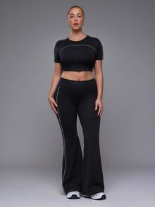 Voyena Women's Plus Size Seamless White Line Trim Sports Set Short Sleeve Flare Pants - Black - View 1