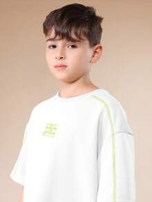 SUMWON Conjunto coordinado de verano para niños con camiseta oversize de cuello redondo y mangas cortas, y pantalones cortos con puntada de contraste - Amarillo - Ver 7