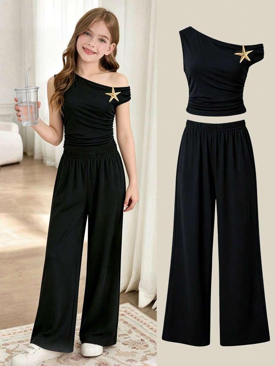 This Tween Girls T-Shirt Set Features An Off-The-Shoulder Design, With A Spaghetti Strap On One Side Supporting The Shoulder While The Other Naturally Falls To Reveal The Shoulder, Creating A Subtly Look. The Gathered Waistline Naturally Accentuates The Figure, Making It Perfect For Spring And Summer. - Black - View 1